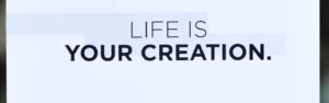 Business card saying "Life is Your Creation"